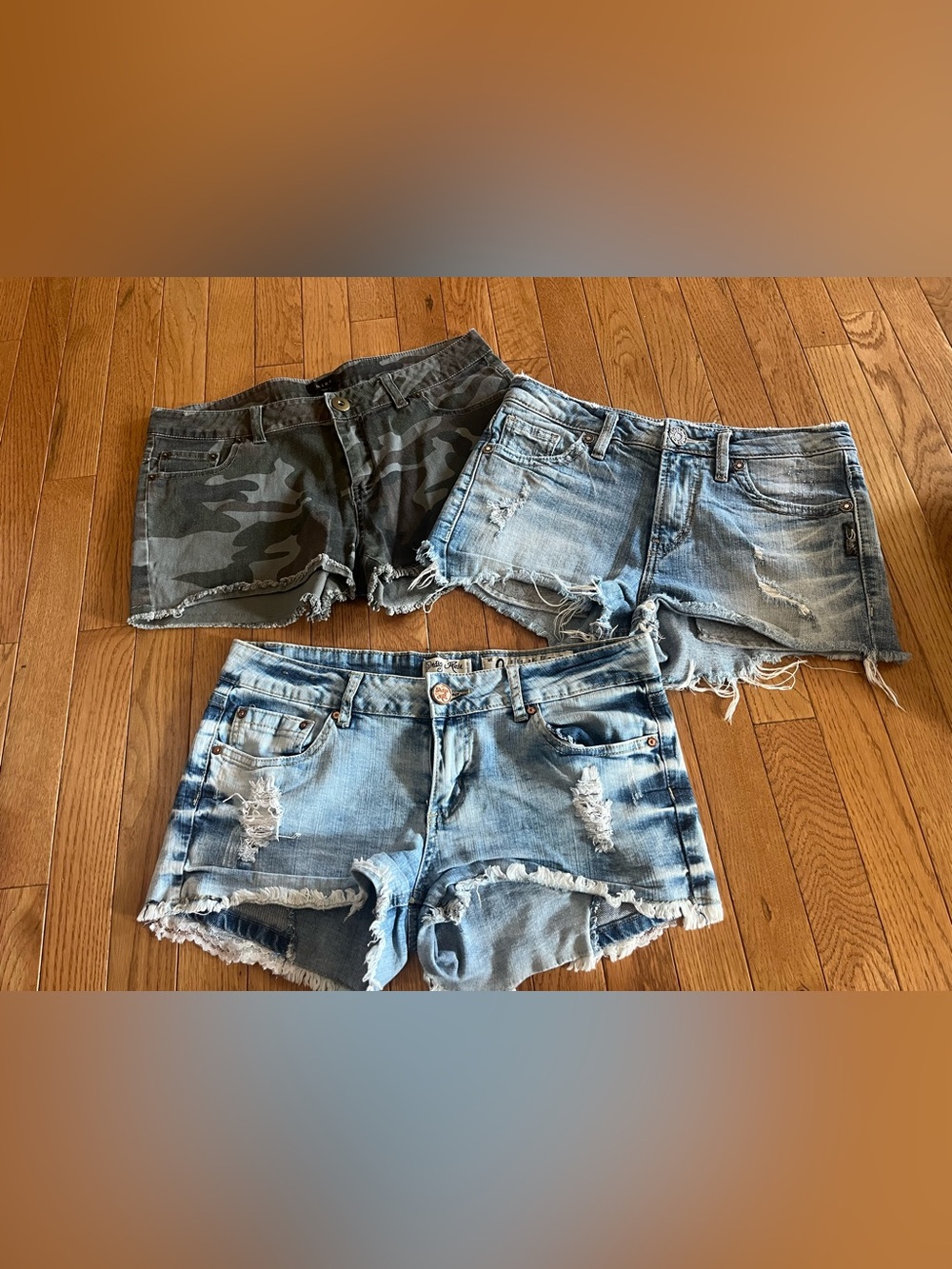 Distressed Denim and Camo Women’s Shorts bundle size 27/28